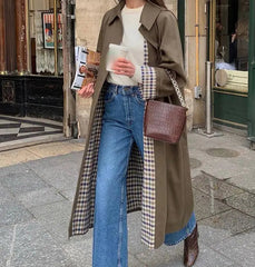 Plaid-lined trench coat styled for autumn city street looks