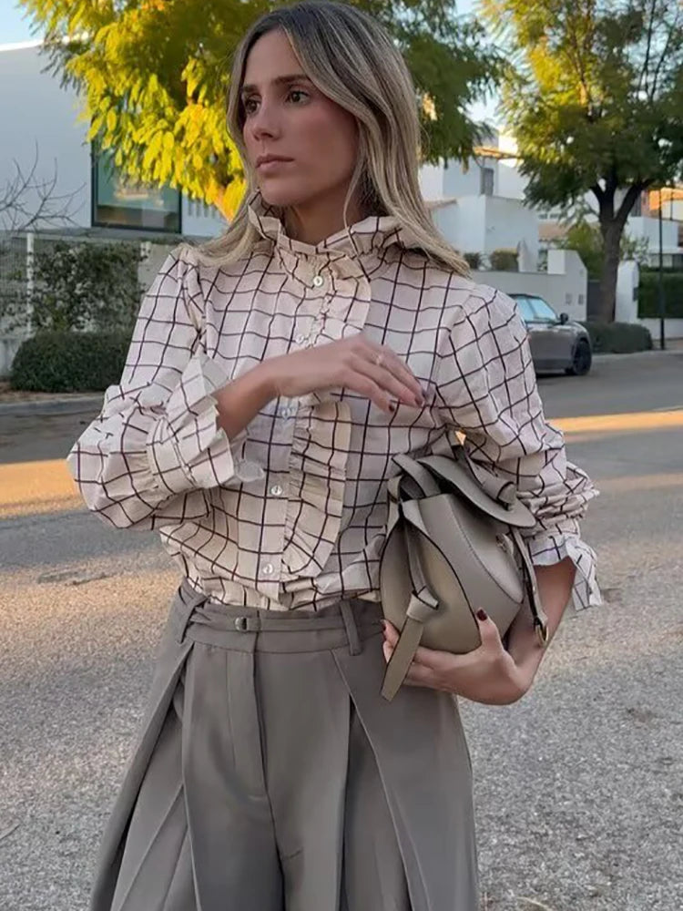 Plaid ruffle blouse styled with stand collar for modern workwear