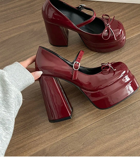 Wine red platform Mary Jane block heel shoes worn indoors