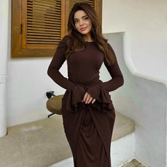 Pleat waist stretch brown gown for women shown in elegant setting