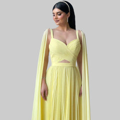 A full-length shot of the pleated evening dress, highlighting its flowing silhouette.