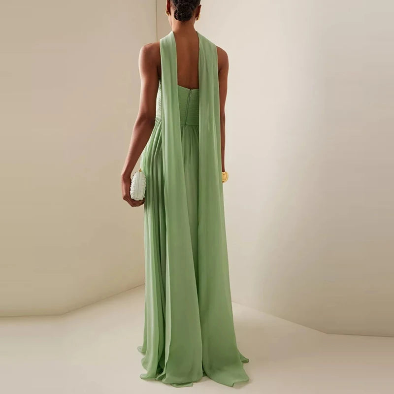 Pleated green evening gown ideal for weddings and galas
