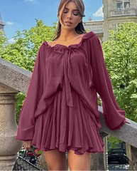 Pleated purple mini skirt and long sleeve blouse featured for statement fashion