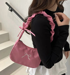 Girly pastel pink handbag for women with bow detail