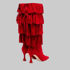 Knee-high red boots with layered pleats and pointed toe