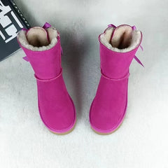 Close-up of bow accent on women’s snow boots