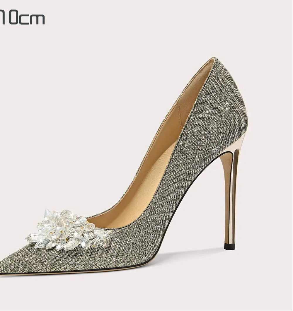Top view of sequin pumps featuring crystal accents and pointed toe shape