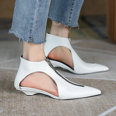 Pointed toe leather zipper shoes styled with denim pants
