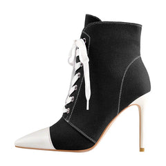 Side view of women’s canvas lace-up ankle boots in black