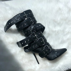 Close-up of pointed toe mid-calf high heel boots