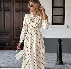 Polka dot dress with bow-tie V-neck and long sleeves