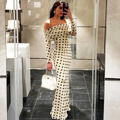 White polka dot slash neck maxi dress styled for city parties

