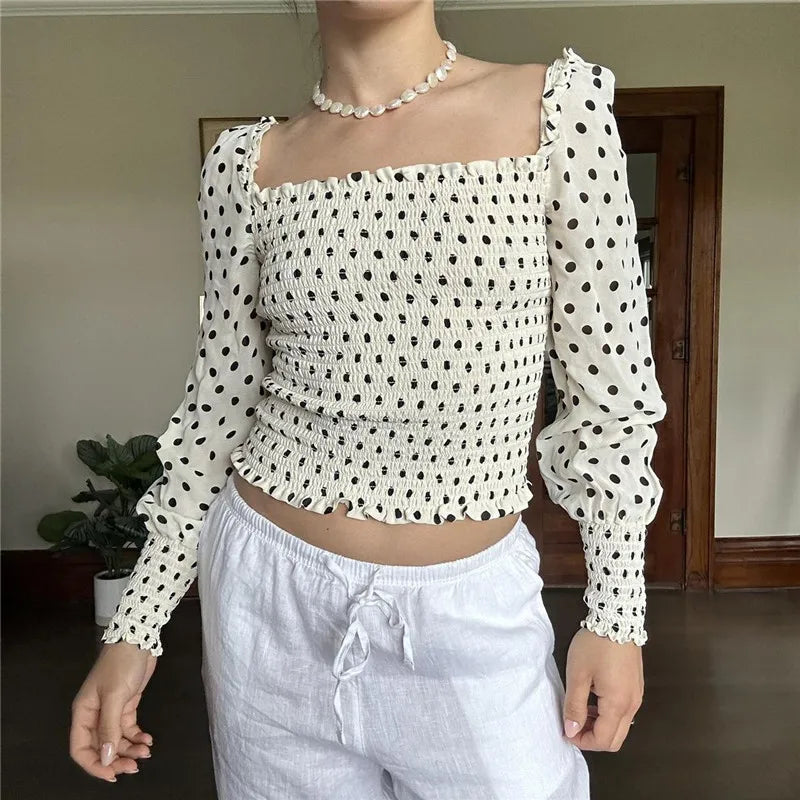Polka dot smocked batwing crop top styled for autumn street and casual wear