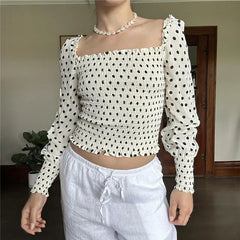 Polka dot smocked batwing crop top styled for autumn street and casual wear