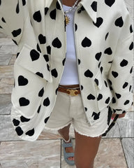 A close-up of the elegant polka hearts and the sleek collar.