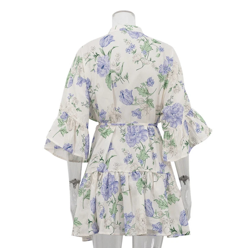 Printed ruffle cuff women’s fall outfit mini dress featured in fresh floral style on a mannequin against a white background