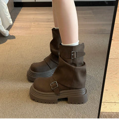 Pair of punk style vintage ankle boots in brown
