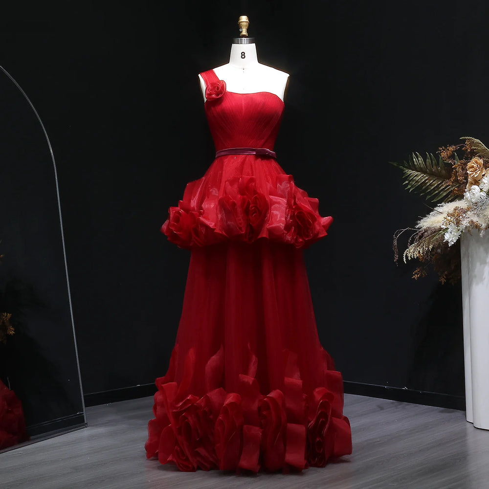 Full-length view of a tiered tulle A-line gown with a backless finish