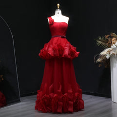 Full-length view of a tiered tulle A-line gown with a backless finish