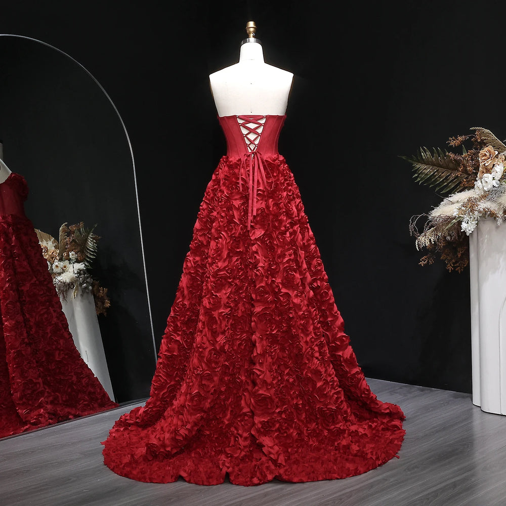 Back view showing the backless finish on a floor-length formal gown