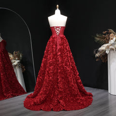 Back view showing the backless finish on a floor-length formal gown