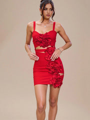 Close-up of red bandage dress featuring sculpted bodice and floral details