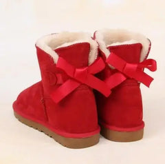 Close-up of bow accent on ankle winter boots