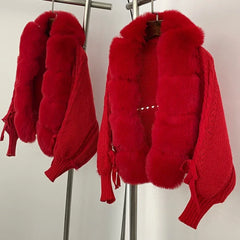 Close-up of the red faux fur collar and front trim highlighting the high-pile texture and soft edge finish.