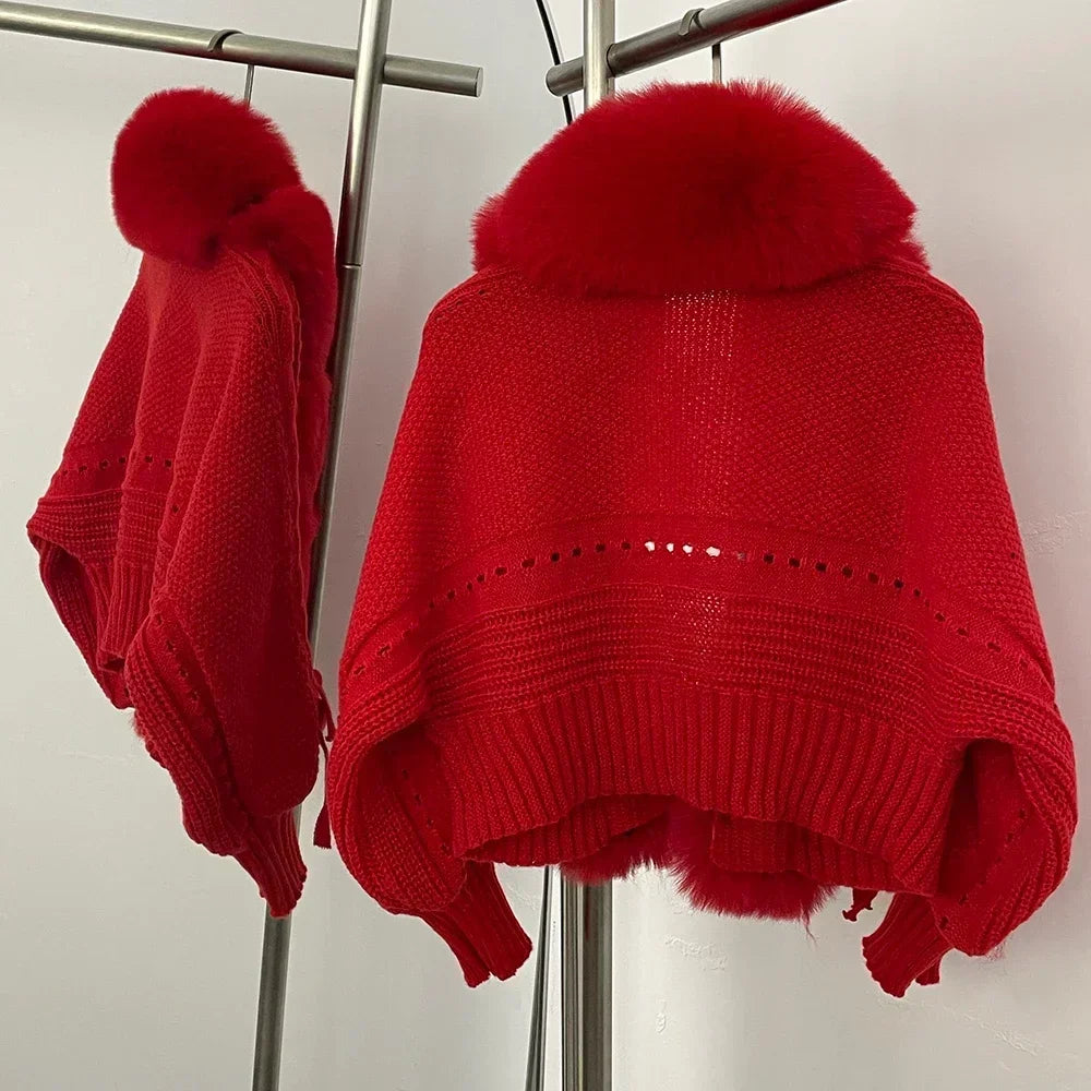 Side angle of the red faux fur and knit jacket showing the layered fur panel depth and sleeve volume on a clothing rack.