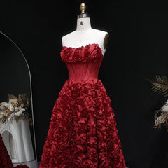 Full-length A-line silhouette with dimensional floral detailing and slit