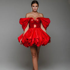 Woman wearing a red satin off shoulder puff mini dress with sequins