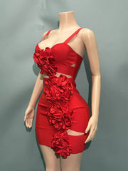 Red dress with floral details on a mannequin against a gray background