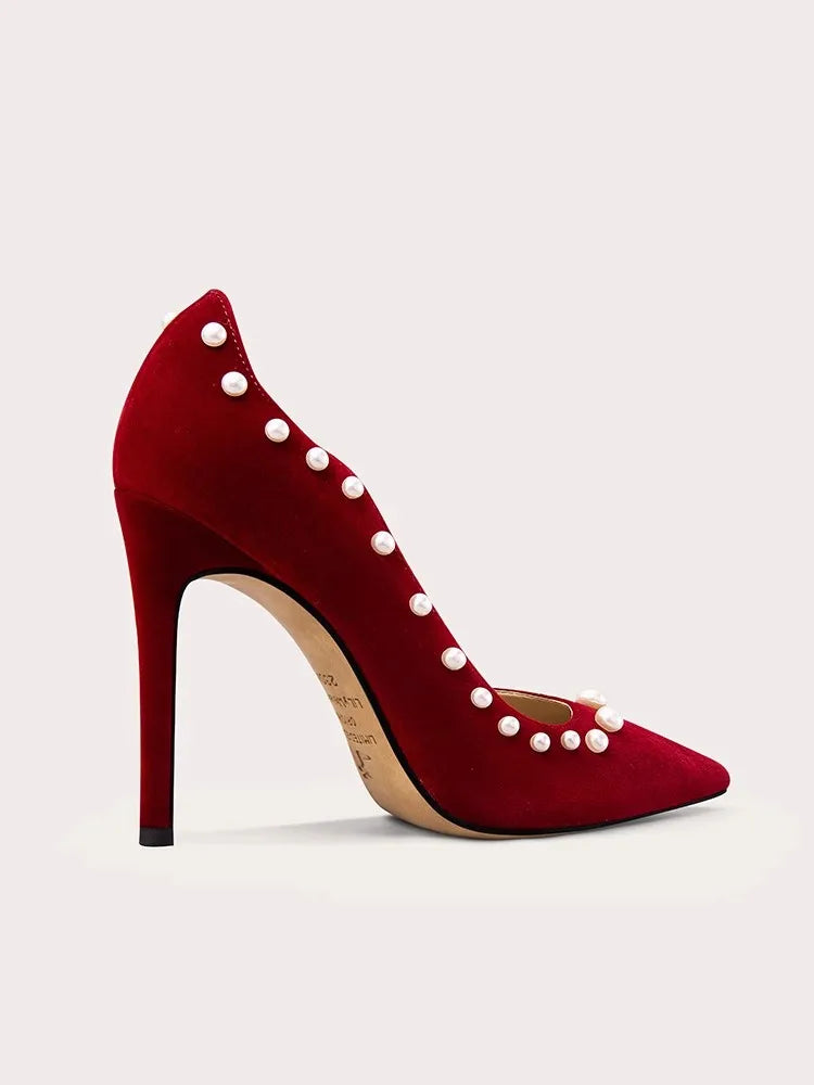 Red pearl embellished pumps in corduroy styled for parties and events