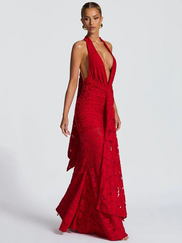 side view showing ruched waist and draped panel on red gown