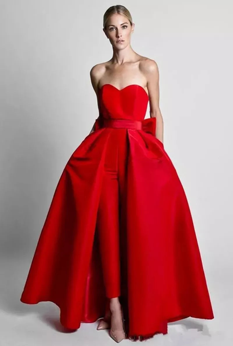 Red satin jumpsuit with detachable A-line skirt and bow