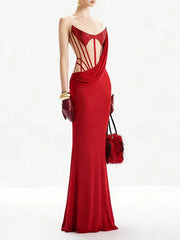 Close-up of the strapless neckline with sequins and sheer mesh paneling, highlighting the contoured look across the bodice.