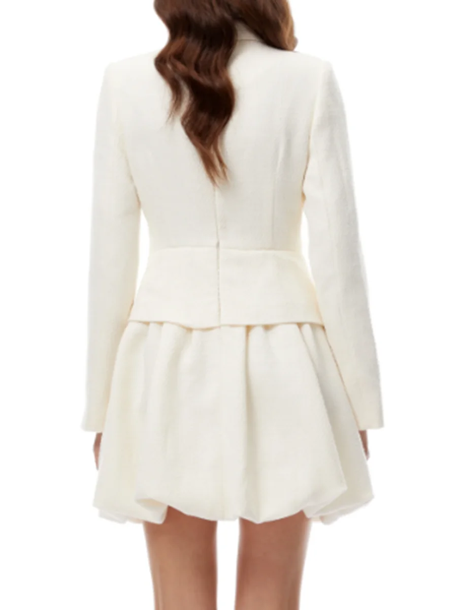 Sculpted hem mini dress styled for premium cocktail or celebration moments