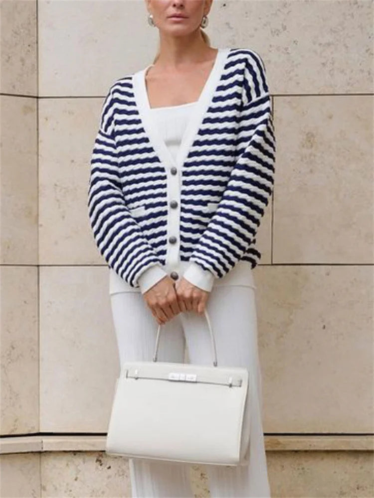 Striped cardigan styled on a boat for relaxed summer look