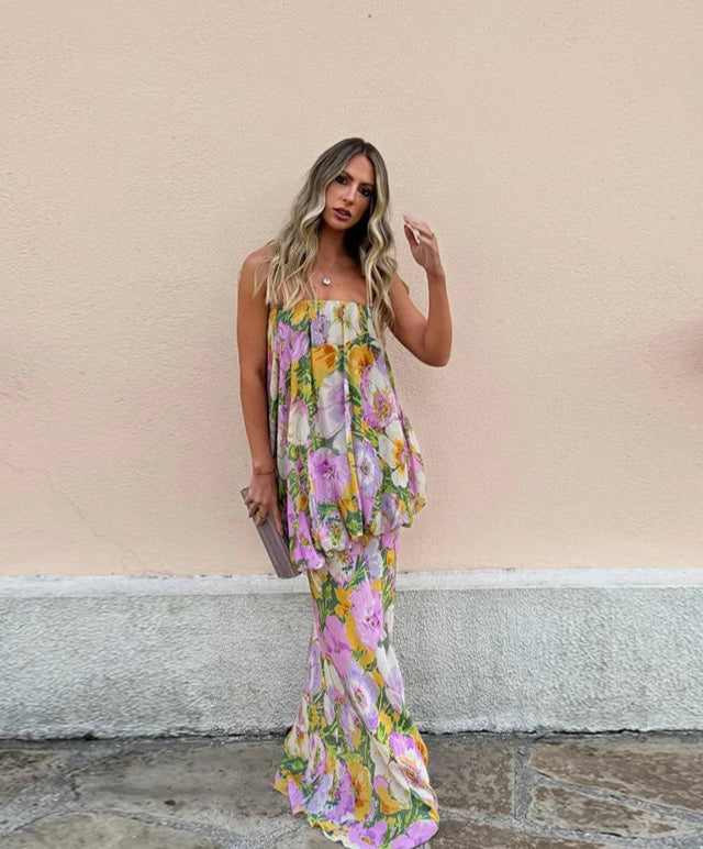 floral strapless maxi styled for a summer event by a wall