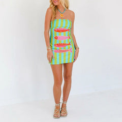 Woman wearing a retro-inspired tube dress styled for summer on a white background