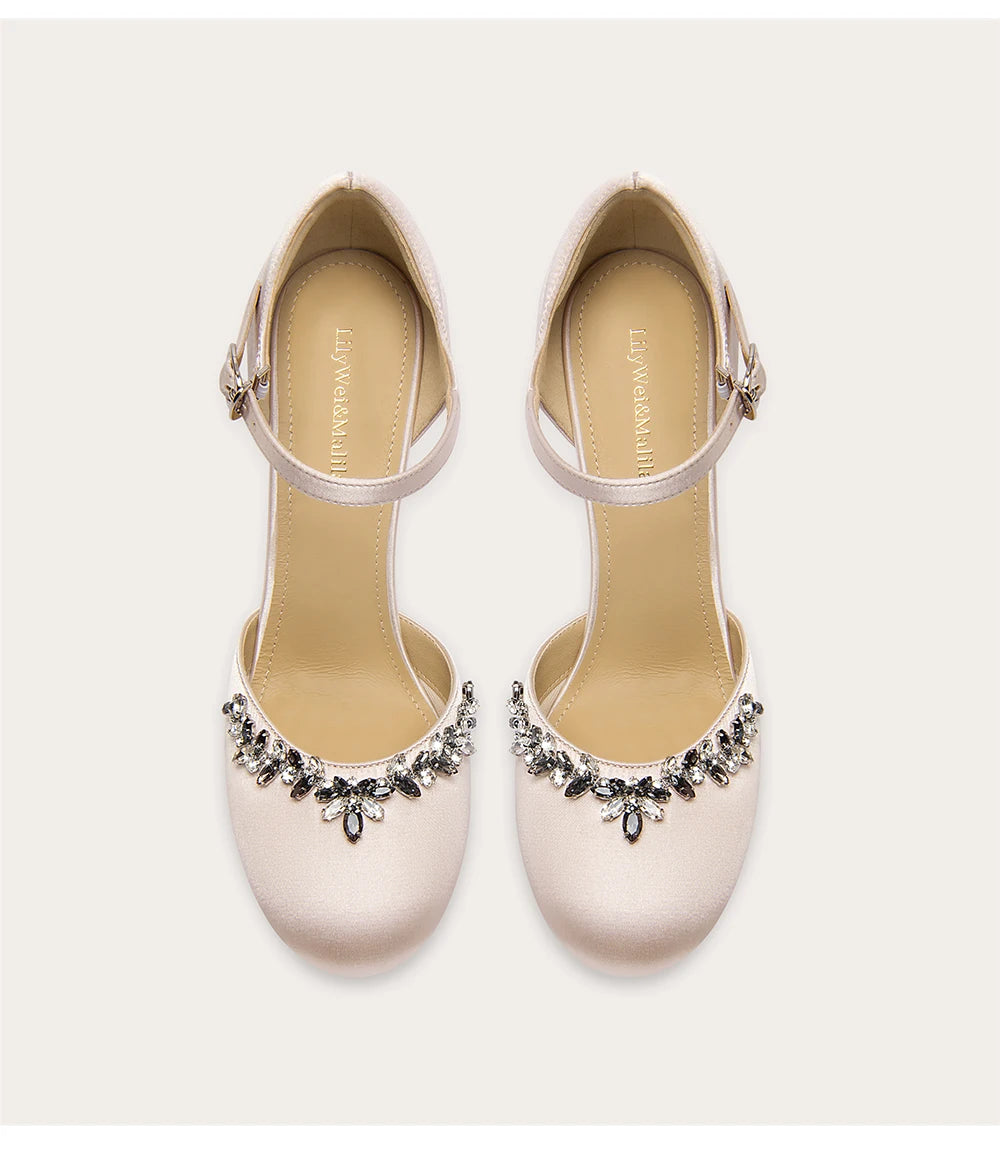 Suede sandals with rhinestone bow and stiletto heel