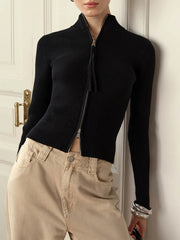 Close-up of slim black ribbed zip cardigan with vintage vibe