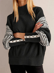 Cuff-focused detail showing ribbed trim with contrast accents and neat binding, emphasizing the sweater’s refined finishing.