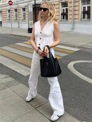 Woman wearing ribbed knit V-neck button vest sweater