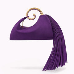 Close-up of ring handle hardware and faux suede texture on mini bag