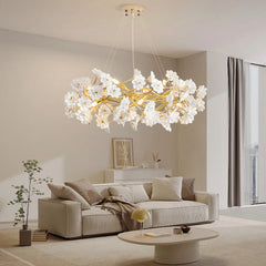 Romantic LED bloom chandelier with gold base in an elegant bedroom