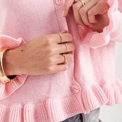 Romantic pink sweater with ruched placket and feminine details