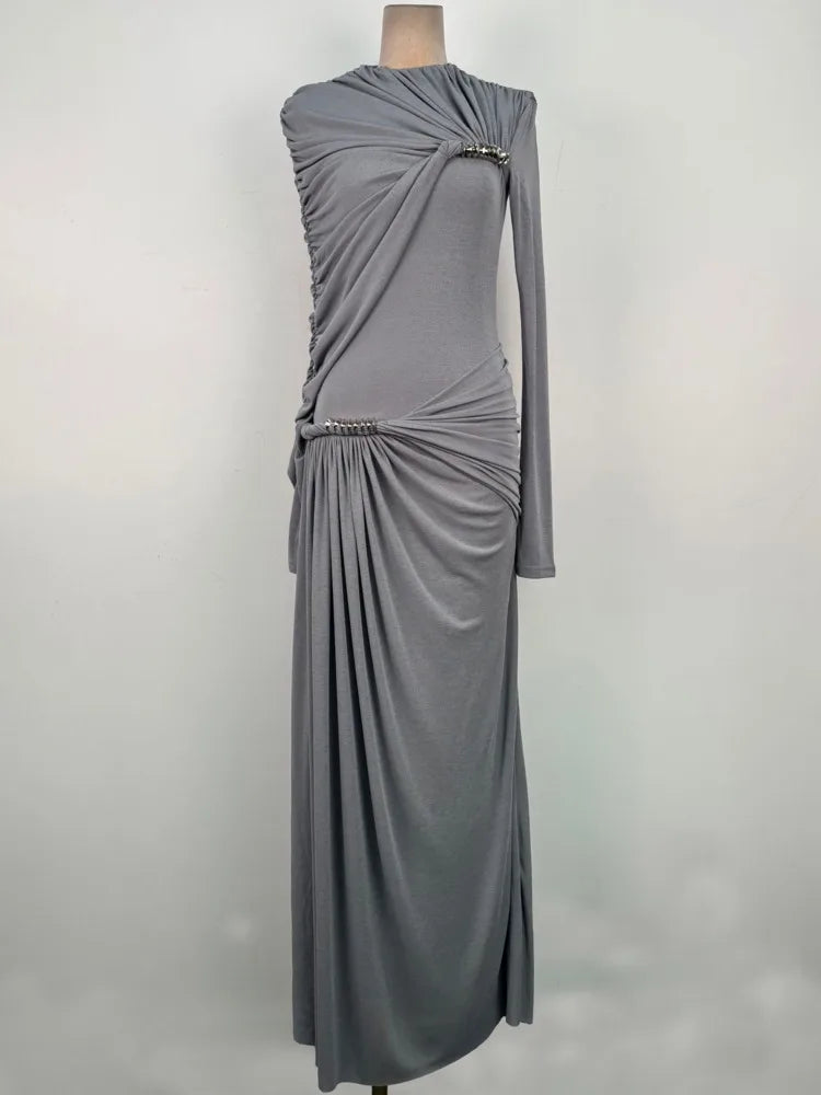 Detail of the ruched hip and waist shaping, creating flattering contour and elegant texture along the slim, elongated silhouette.