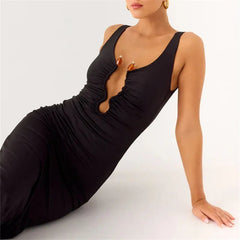 Close view of the black plunge neckline showing gathered ruching and a subtle knot-like finish at the center front.