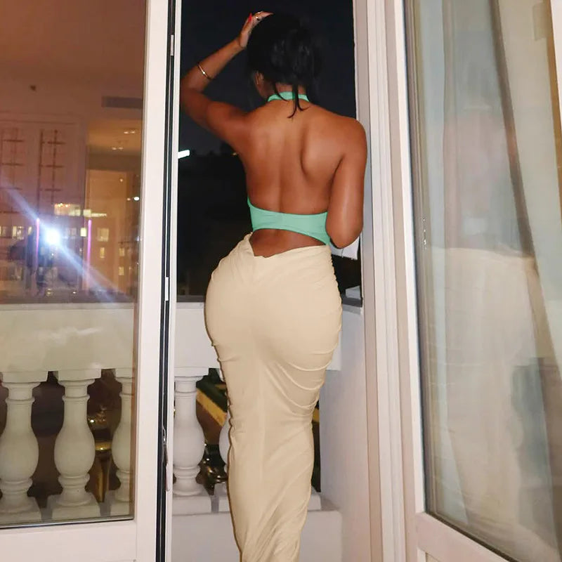 A close-up of the ruched patchwork detail on the halter dress.